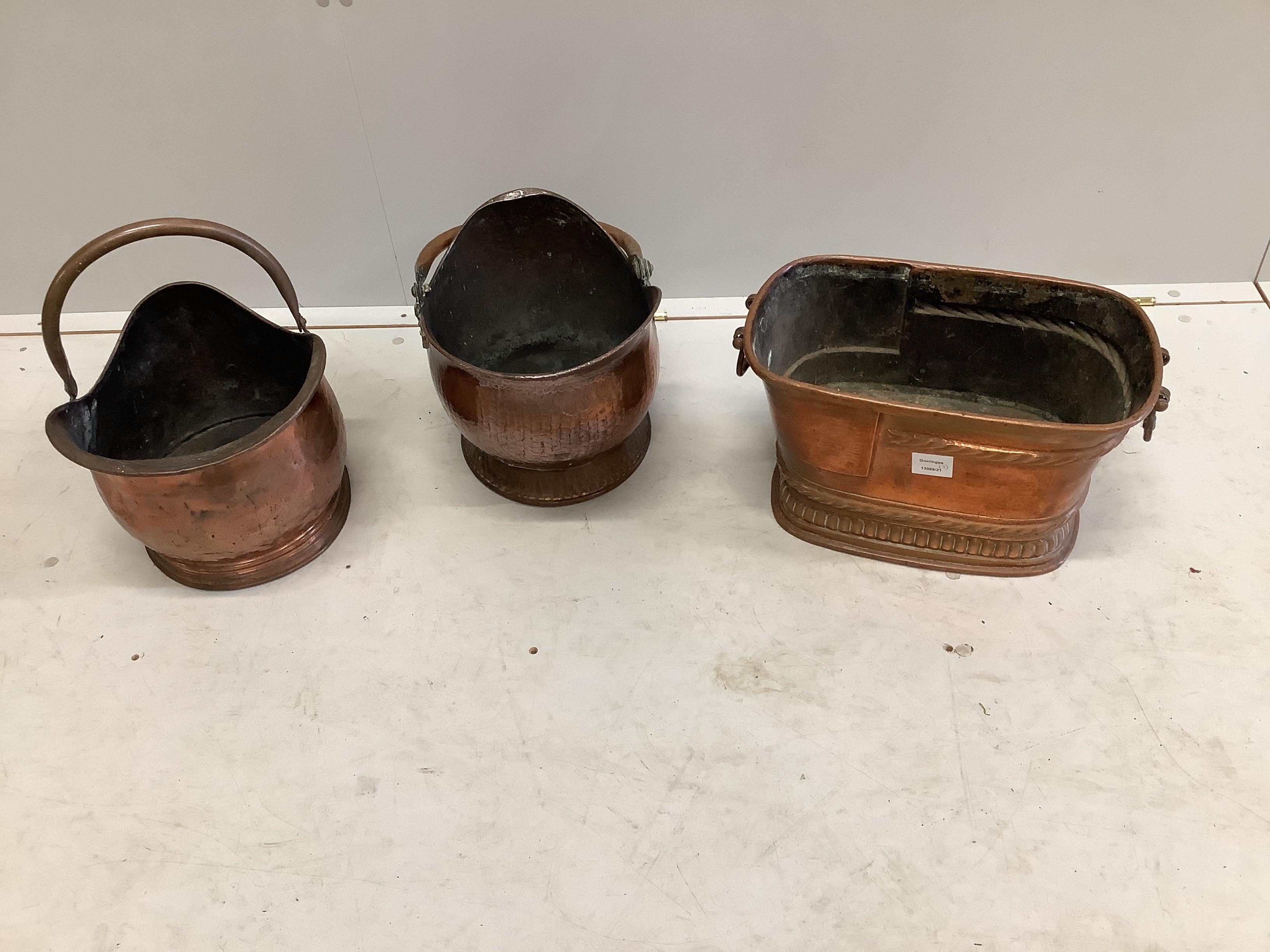 A 19th century Dutch copper wine cooler, width 42cm, height 24cm together with two Victorian copper coal scuttles